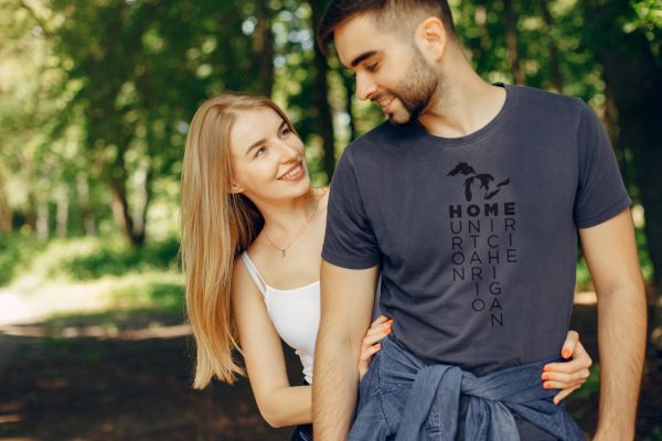 young couple on a walk in the woods with Great Lakes custom t-shirt
